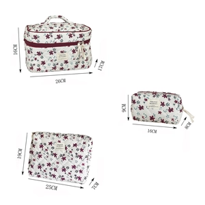 Three-piece floral corduroy makeup bag set with size labels and vintage ribbon detail