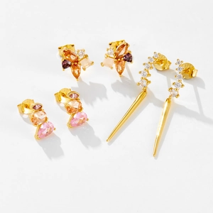 Detail showing S925 sterling silver studs with zircon flower and pear-shaped gems