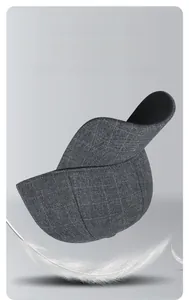 Detail view of grey plaid baseball cap with warm crystal velvet lining and soft feathers