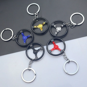Zinc alloy steering wheel keychains in five colors on a professional dual-tone background