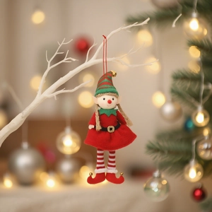 Christmas elf couple hanging ornament with striped hat and red dress on a white branch