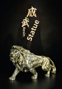 Close-up of golden lion resin statue featuring detailed muscle texture and walking pose