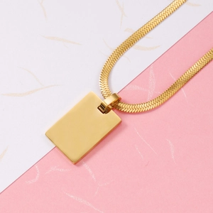 Golden herringbone chain necklace with rectangular polished steel pendant for couples