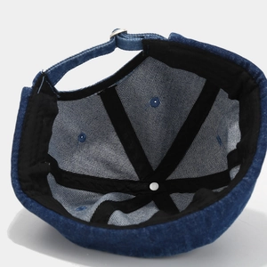 Deep blue denim Miki hat featuring interior stitching and adjustable metal strap