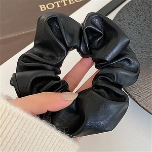 French style black leather scrunchie with soft pleats and premium texture for women