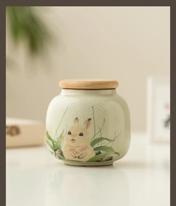 Detail of Ru porcelain tea caddy with hand-painted rabbit and wooden lid for storage