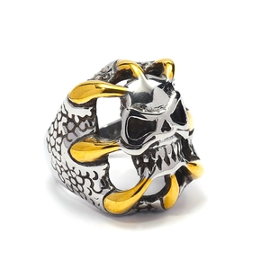 Gothic skull and golden claw ring in silver stainless steel for men on white background