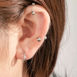Minimalist double-layered curved stud earrings in silver finish with sparkling zircons