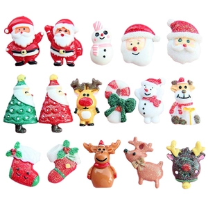 Assorted Christmas resin charms including Santa, reindeer, and trees for DIY crafts