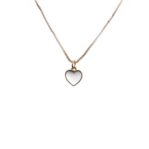 Detailed close-up of a gold-plated box chain with a white heart enamel pendant