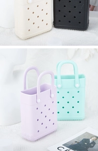 Mini EVA beach bags with hollow round holes and snap-on handles in multiple pastel colors