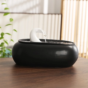 Detail of minimalist ceramic pet fountain with sleek gooseneck spout and water circulation