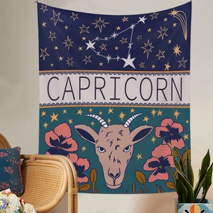 Detail view of Capricorn zodiac tapestry with navy starry sky and goat illustration