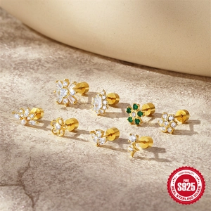 Set of eight gold S925 sterling silver stud earrings with floral and crown designs