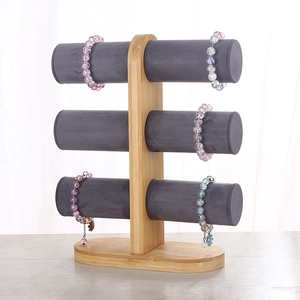 Three-tier bamboo jewelry stand with grey velvet bars for bracelets and watches