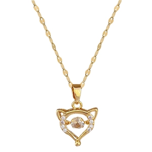 Elegant gold fox pendant necklace with cubic zirconia stones on a polished titanium steel chain