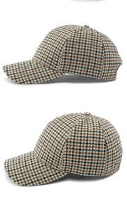 Detailed side view of houndstooth baseball cap with brown and black plaid pattern