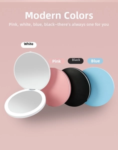 Close-up of portable LED folding makeup mirror showing the dual-sided design in four colors