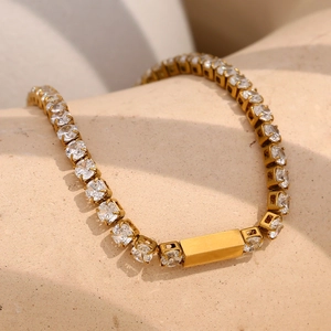 Detail of 18K gold plated bracelet with 3mm zircons and a central engravable metal plate