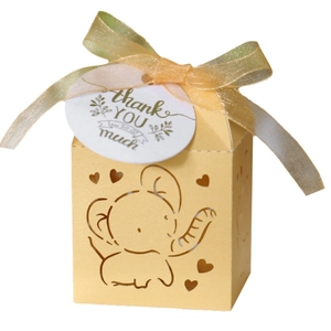Yellow laser-cut elephant wedding favor box with gold ribbon and thank you tag