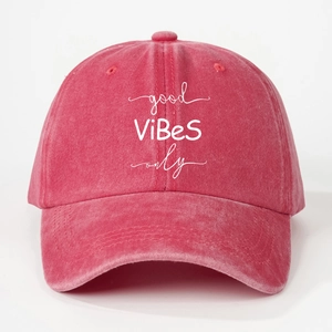 Detail of deep pink washed cotton baseball cap with white good ViBeS only embroidery