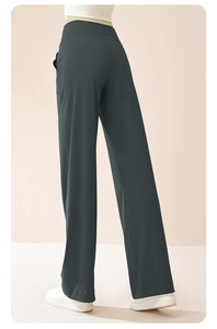 Detail view of charcoal gray high-waisted wide-leg yoga pants with side pockets