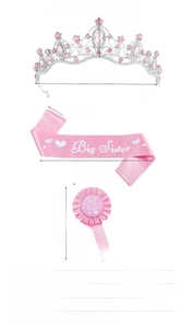 Detailed view of pink Big Sister sash, sparkling rhinestone tiara, and pleated badge set