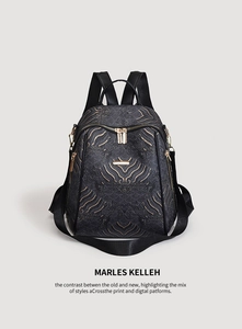 Detailed view of Chinese style black backpack with gold zippers and premium leather texture