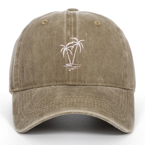 Detail of pink coconut tree embroidery on vintage washed brown cotton baseball cap