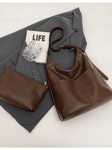 Brown leather tote bag set including a large shoulder bag and small pouch for women