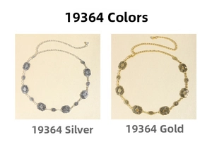 Detail of vintage silver and gold metal waist chains with bohemian engraved patterns