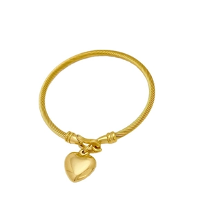 Gold twisted wire bangle featuring a polished heart pendant and secure horseshoe clasp