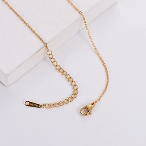 3D butterfly necklace detail featuring gold stainless steel lobster clasp and extender