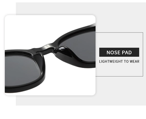 Macro detail of the integrated lightweight nose pads on black square frame sunglasses