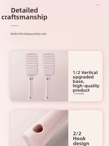 Detail of pink vent hairbrush featuring a stand-up base and handle hanging hole
