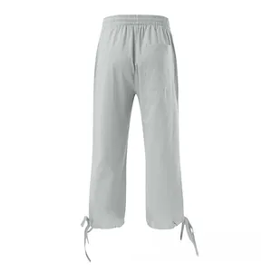 Detail view of cotton linen pants featuring elastic waist and drawstring hem design