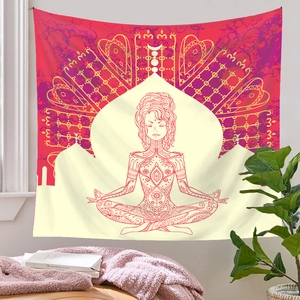 Detail view of mandala tapestry with woman meditating and bohemian patterns on white wall
