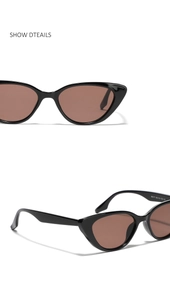 Detailed macro view of black cat-eye sunglasses featuring dark lenses and CE certification marks