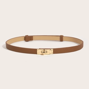Detail of slim dark brown leather belt featuring a gold rotating lock and Saffiano texture