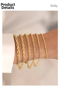Close-up of various widths of 18K gold plated rope chains on a model's wrist