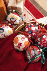 Close-up of festive red cotton socks with embroidery in pearl ball gift packaging