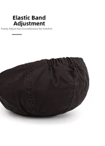Close-up of black cotton newsboy hat featuring an elastic back for adjustable sizing