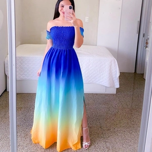 Detail of vibrant gradient off-shoulder maxi dress with side slit and smocked bodice