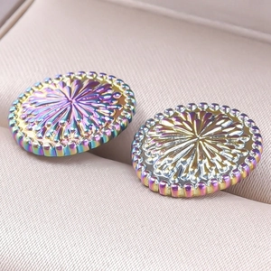 Macro shot of 304 stainless steel stud earrings with iridescent radial texture