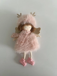 Close-up of pink plush angel ornament with golden antlers and cozy winter boots