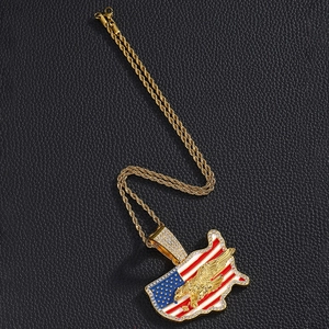 Macro detail of gold hip hop necklace featuring American flag eagle pendant with rhinestones