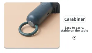 Detail view of portable mini fan with integrated carabiner and USB-C charging port