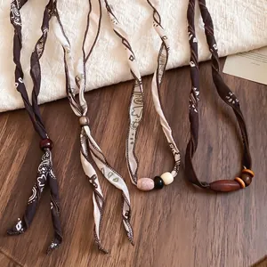 Bohemian paisley print fabric necklaces set with natural wooden beads in earth tones