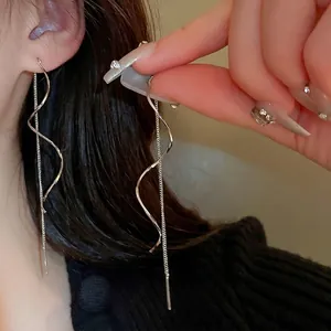 Silver twisted geometric drop earrings with long spiral metal line and delicate chain link