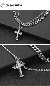 Detailed view of silver cross pendant with white zircon inlays and double layered chain